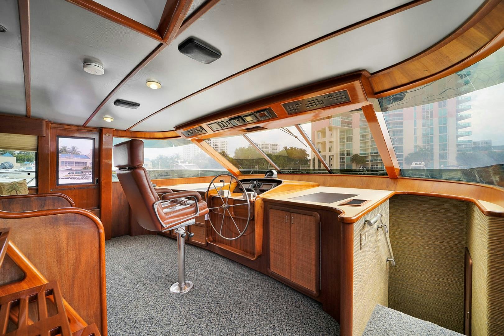 a bus with a desk and a chair aboard STEALIN TIME Yacht for Sale
