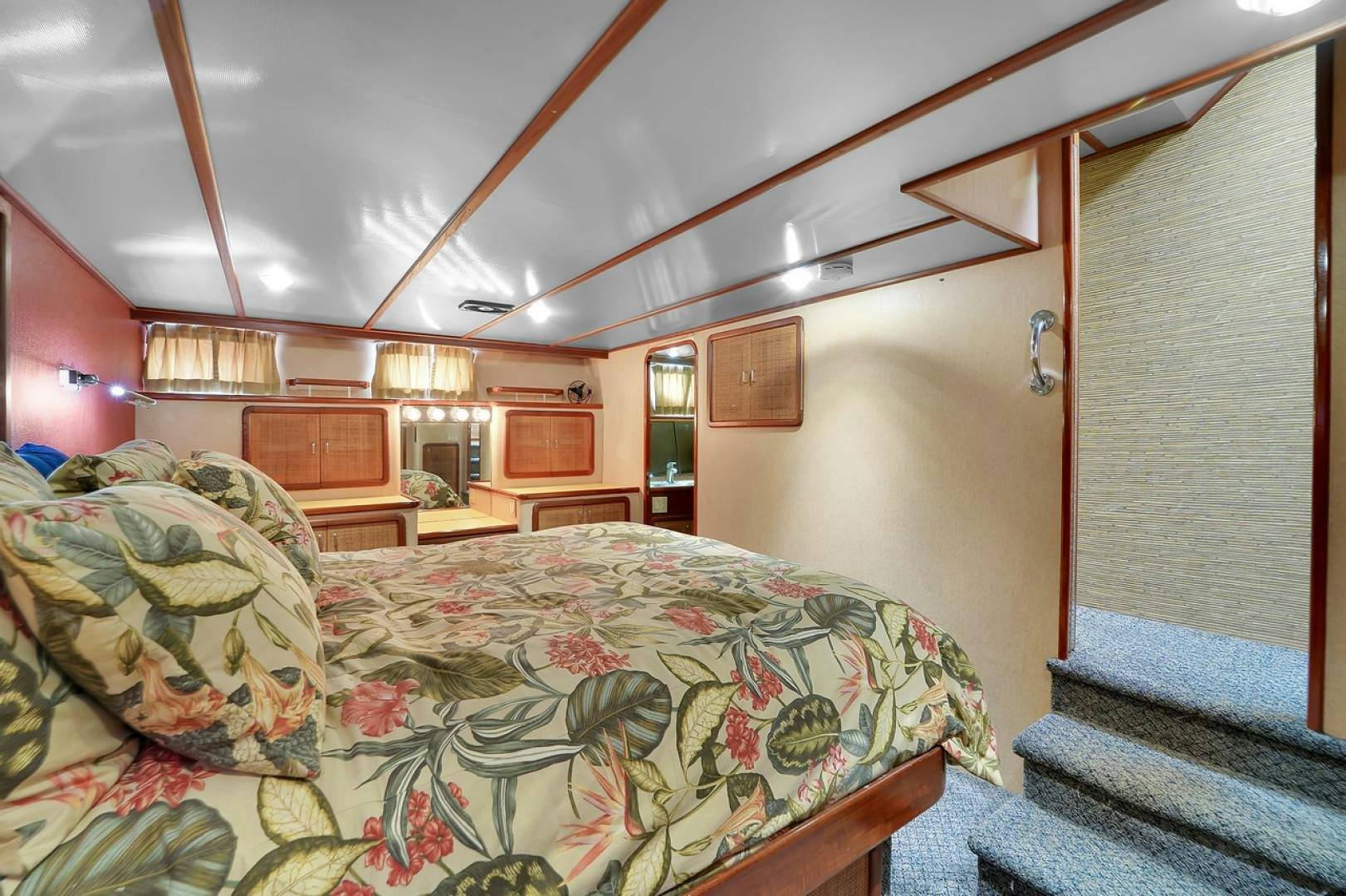 a bedroom with a bed and a wood ceiling aboard STEALIN TIME Yacht for Sale