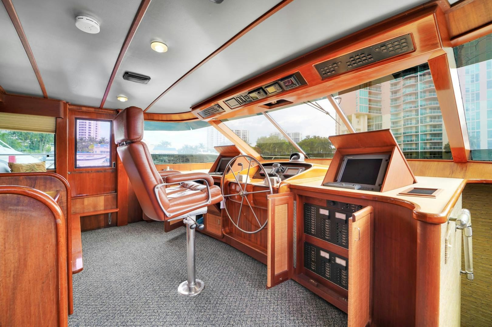 a room with a desk and a tv aboard STEALIN TIME Yacht for Sale
