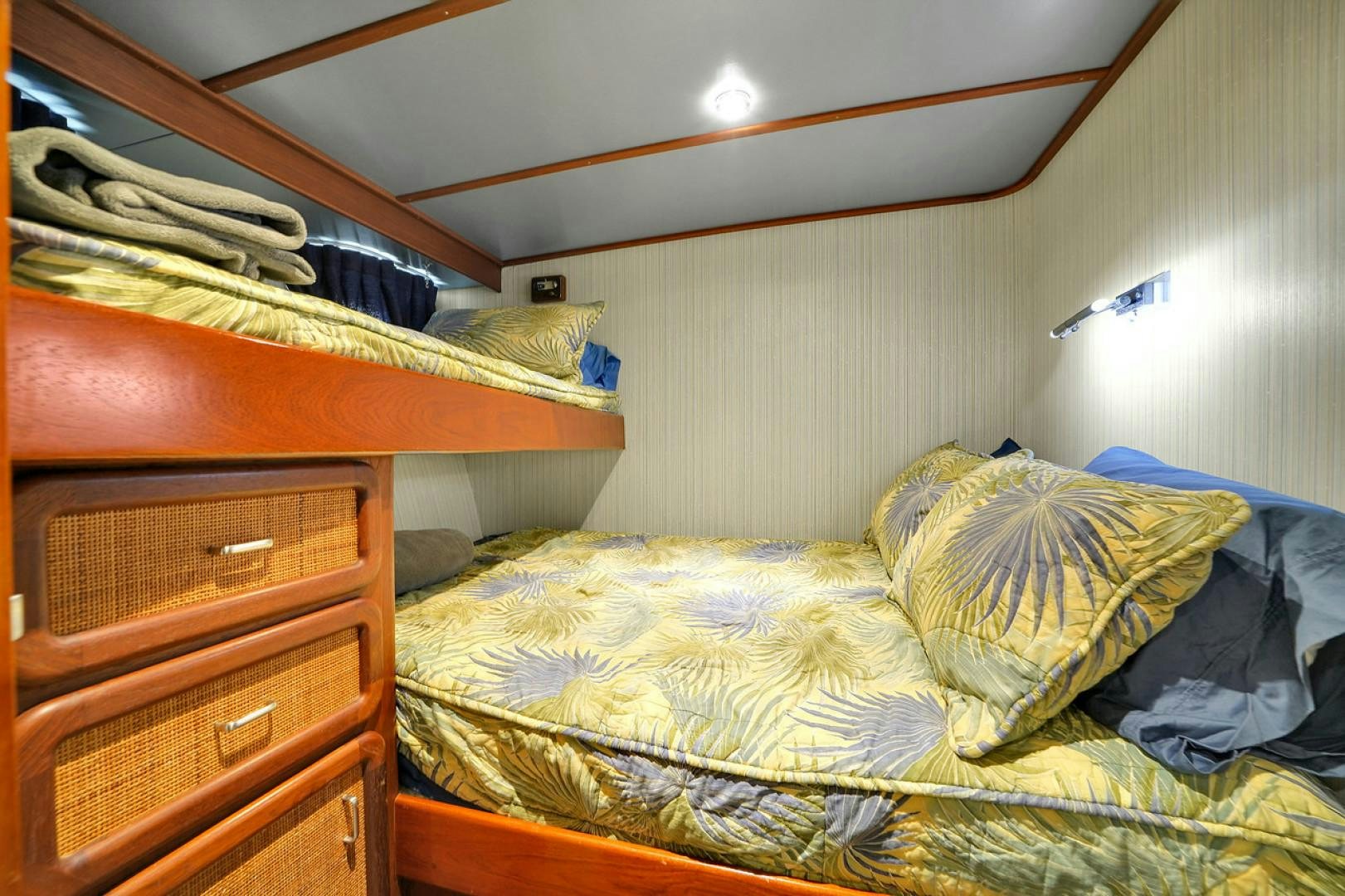 a bedroom with bunk beds aboard STEALIN TIME Yacht for Sale