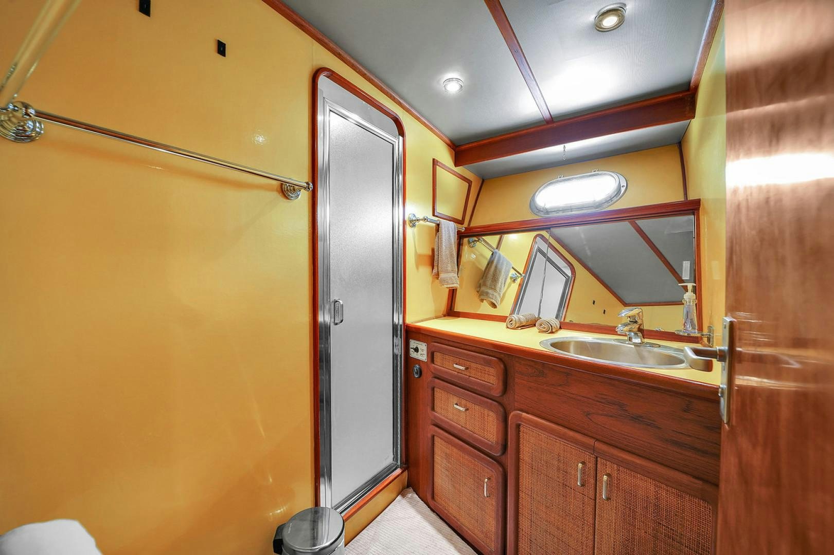 a bathroom with a sink and cabinets aboard STEALIN TIME Yacht for Sale