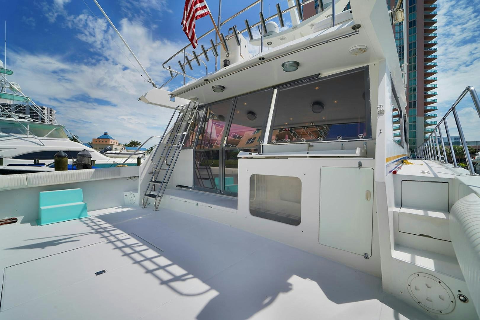 a white boat on a dock aboard STEALIN TIME Yacht for Sale