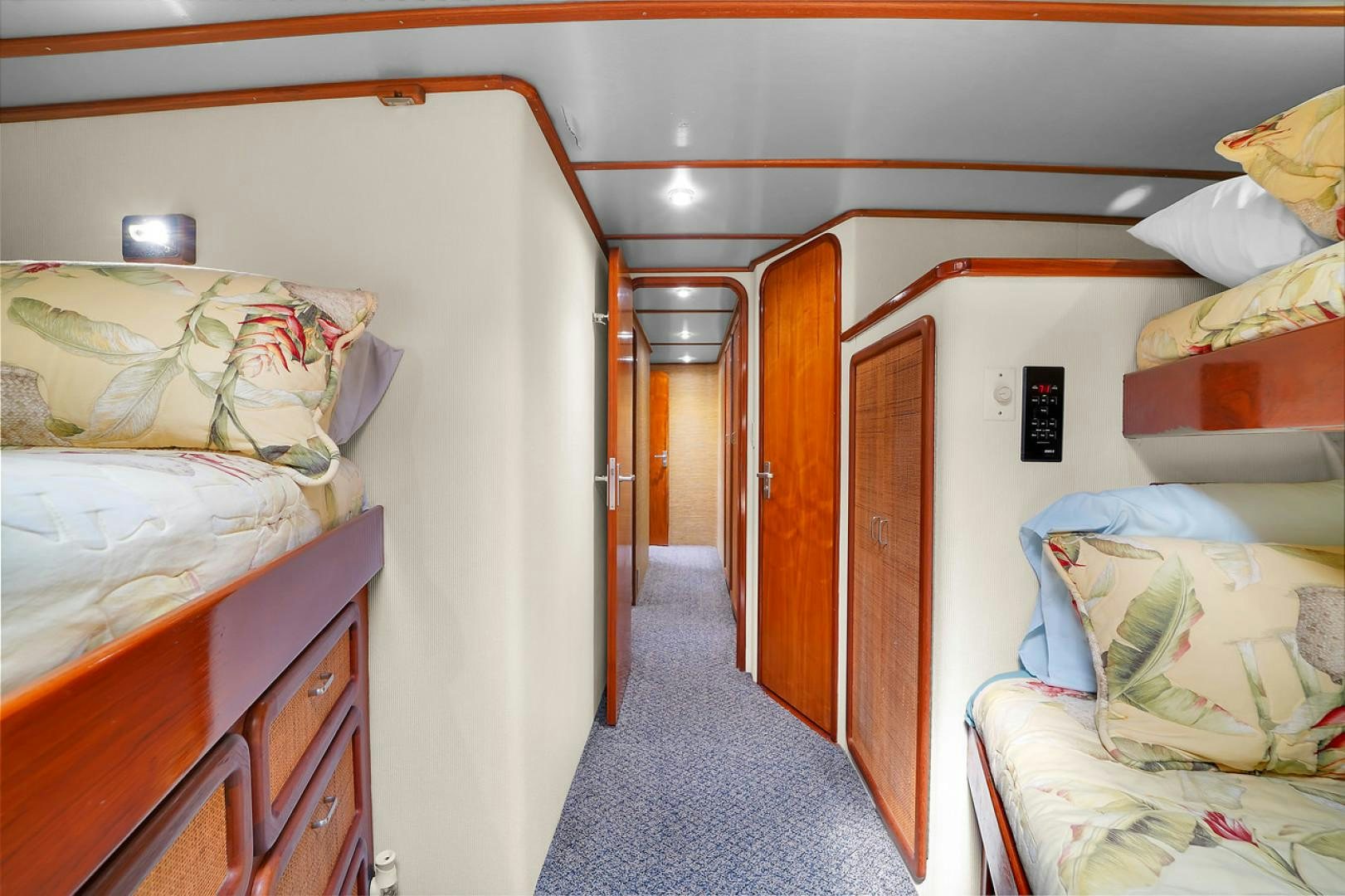 a room with a bed and a door aboard STEALIN TIME Yacht for Sale