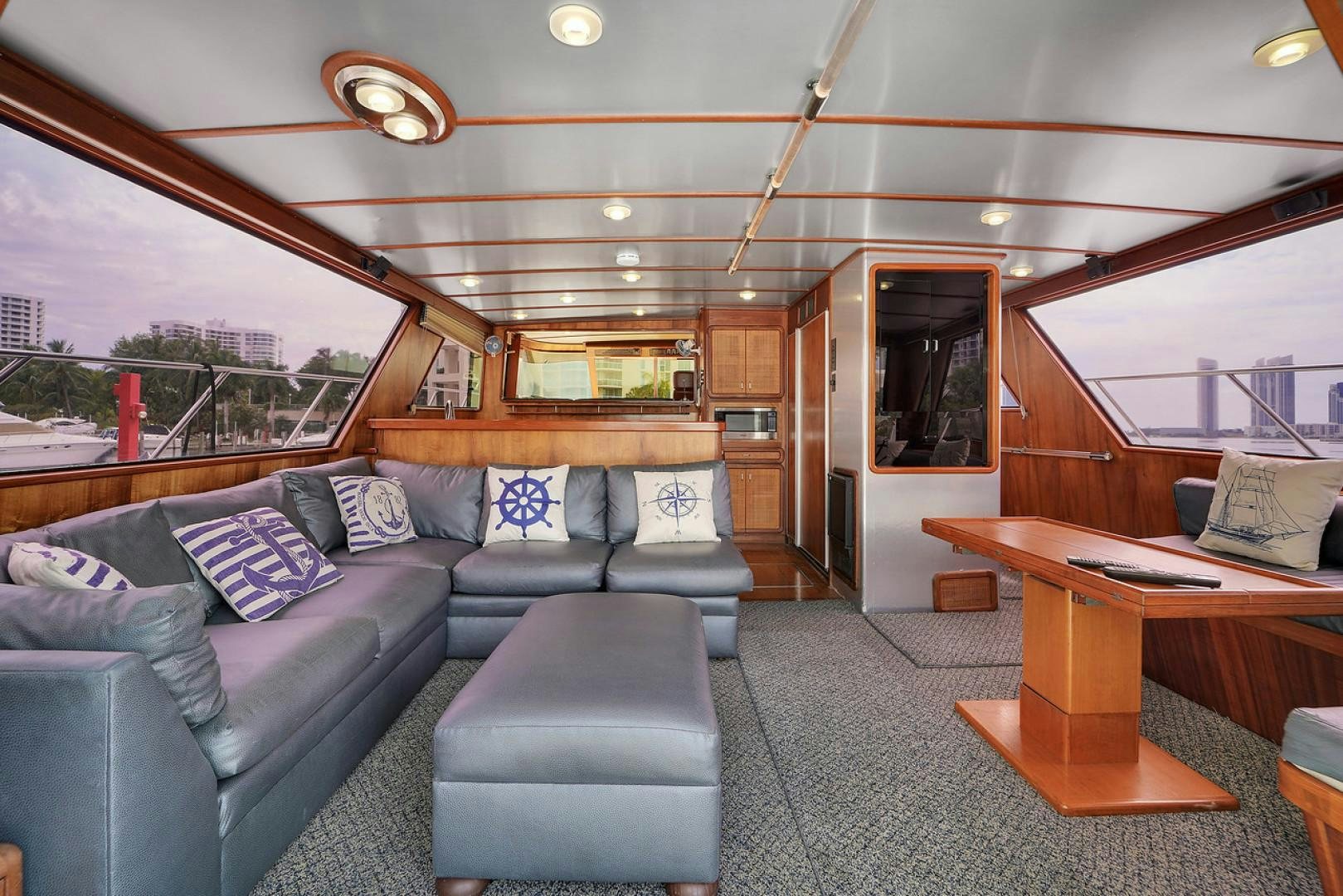 a living room with a couch and a table aboard STEALIN TIME Yacht for Sale