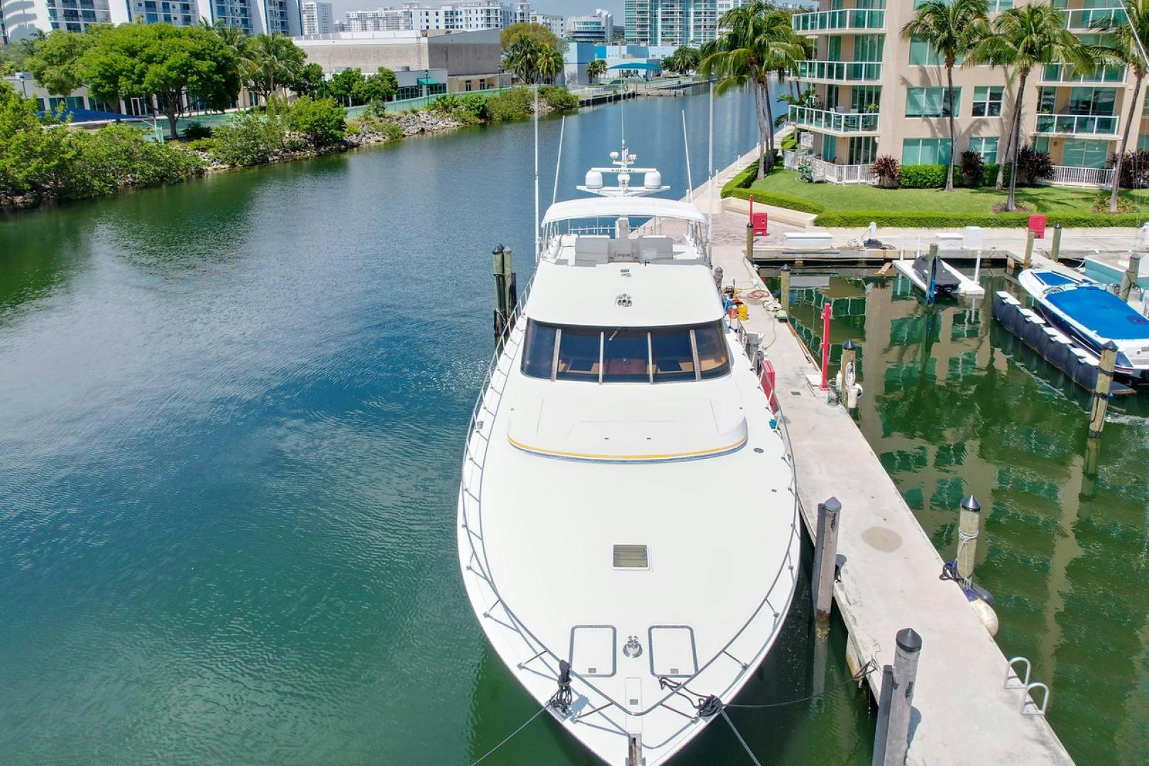 a boat is parked on the side of the water aboard STEALIN TIME Yacht for Sale