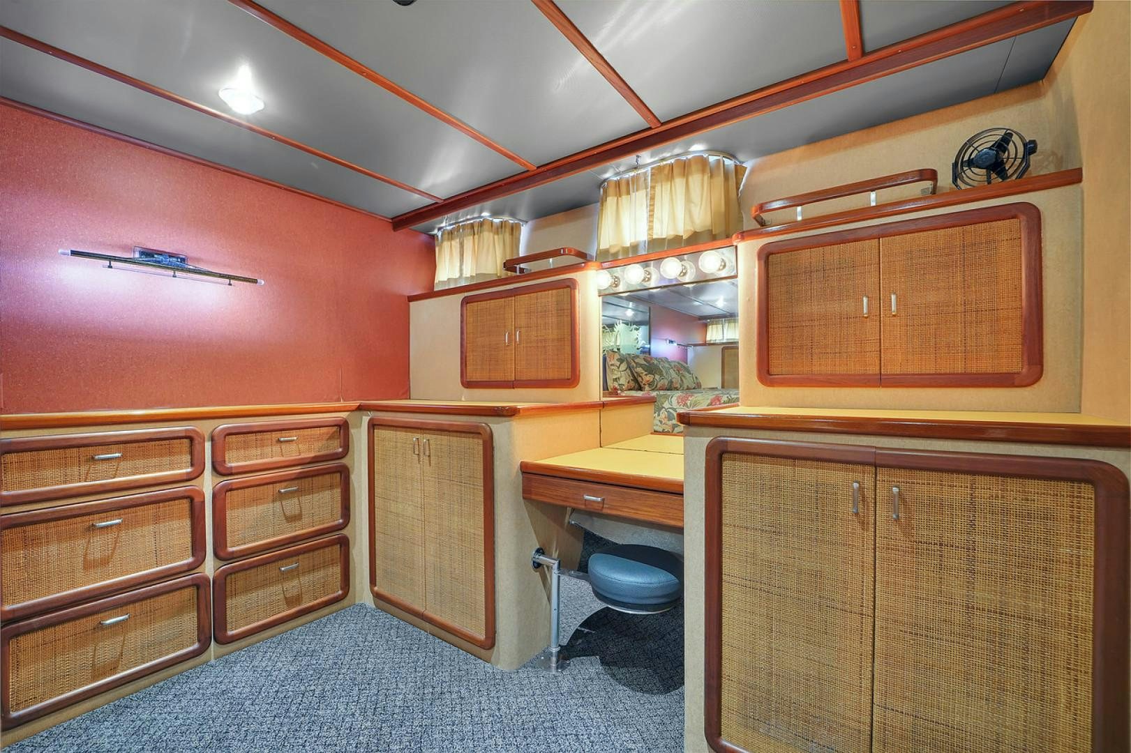 a kitchen with wooden cabinets aboard STEALIN TIME Yacht for Sale