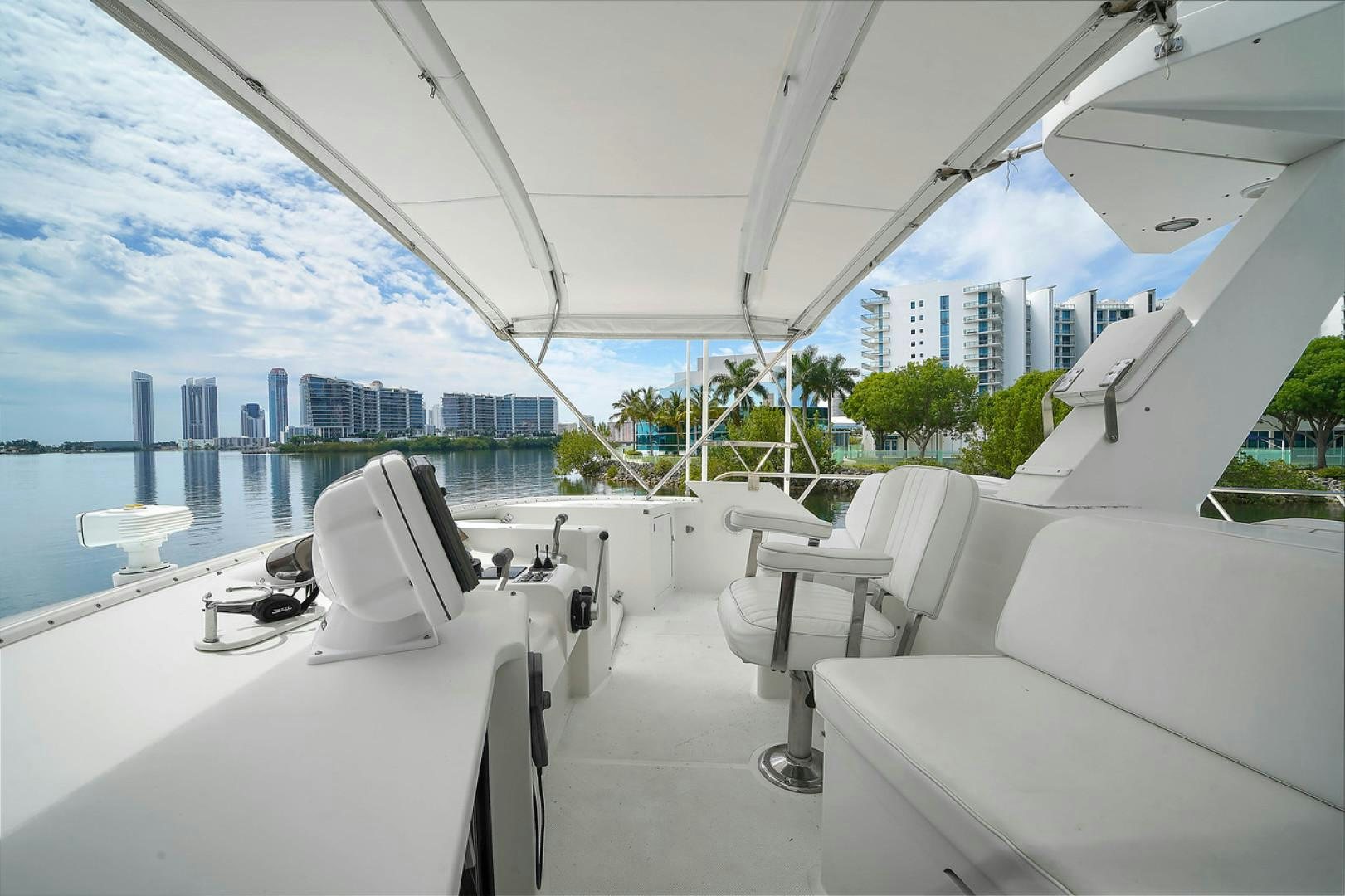 a room with a view of a city and a large window aboard STEALIN TIME Yacht for Sale