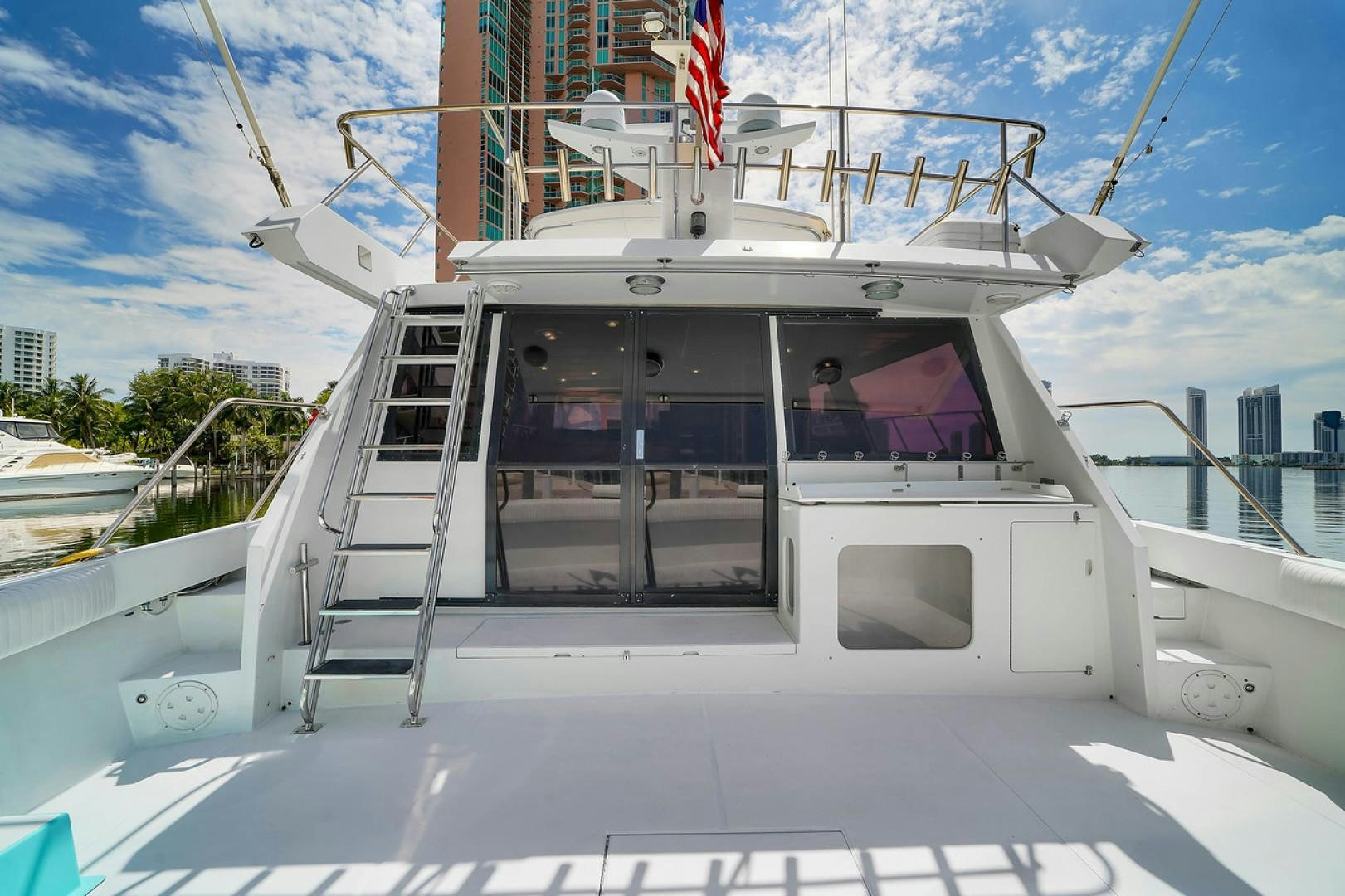 a white boat with a door open aboard STEALIN TIME Yacht for Sale