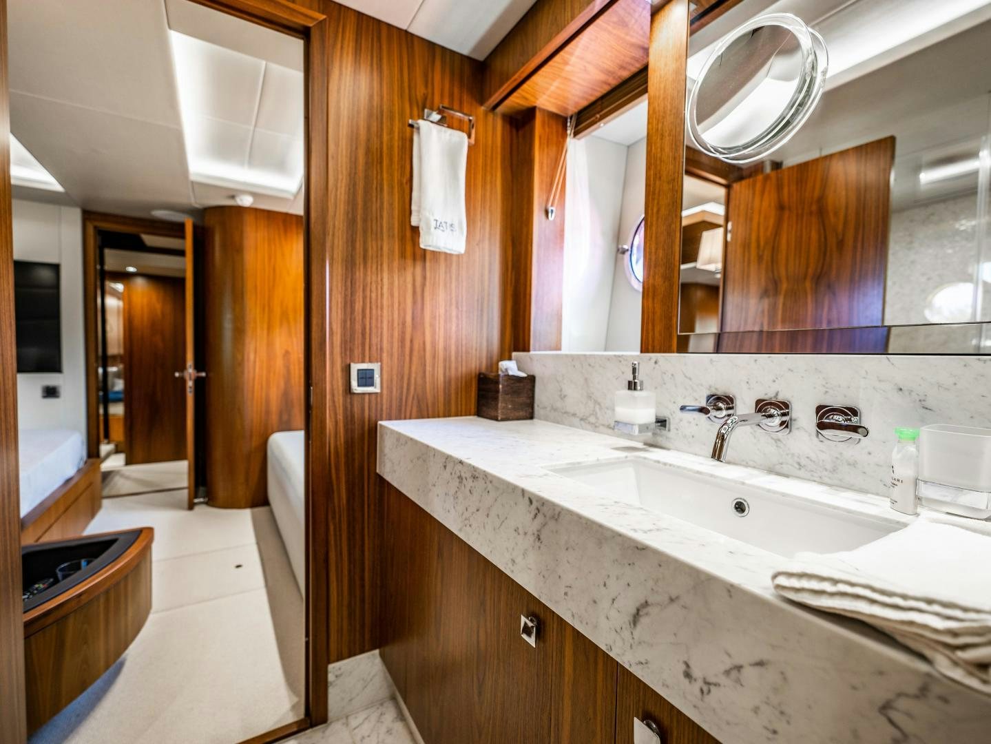 a bathroom with a large mirror aboard TATIS Yacht for Sale