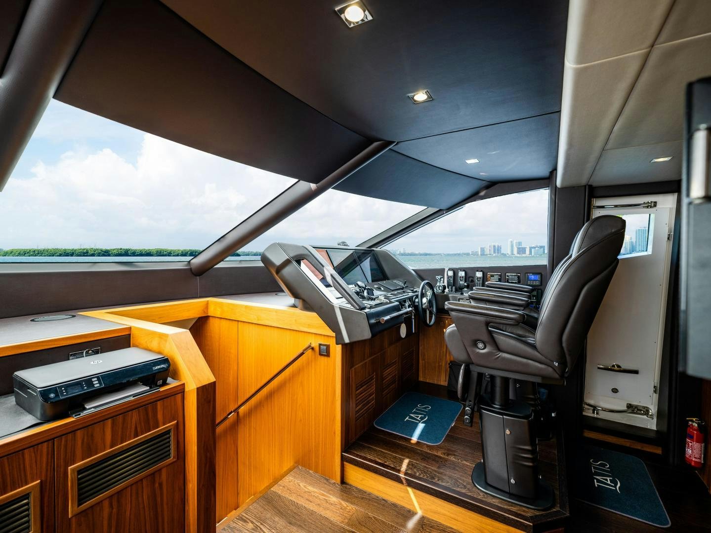 a room with a desk and a chair aboard TATIS Yacht for Sale