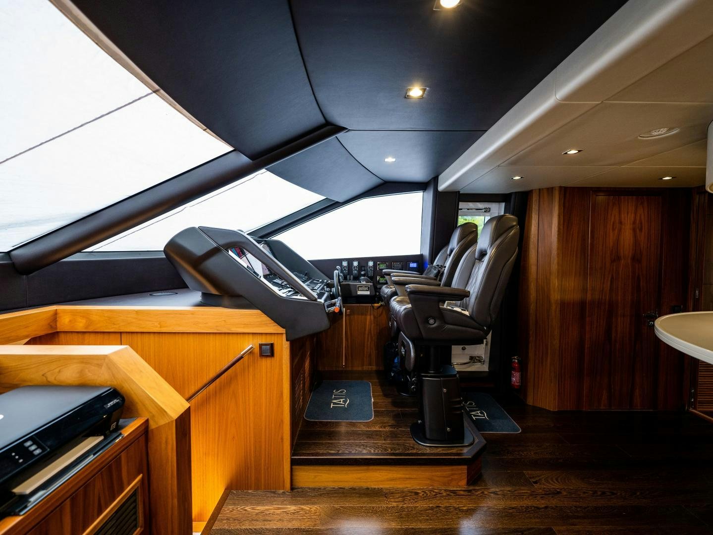 a room with a desk and a chair aboard TATIS Yacht for Sale