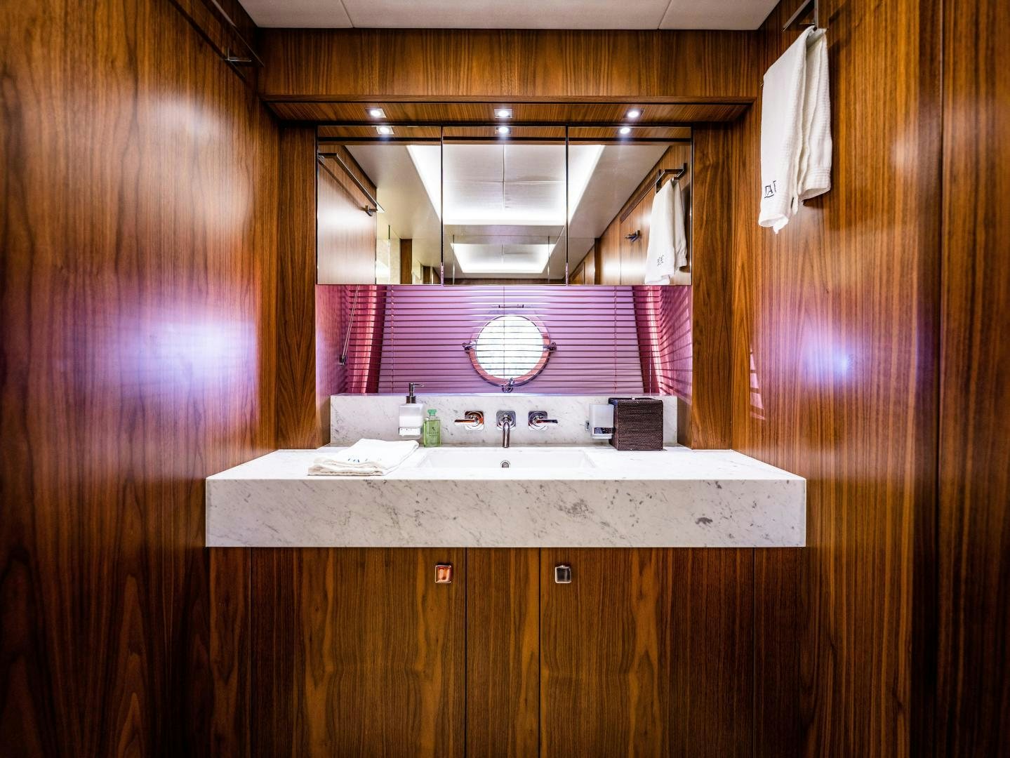 a bathroom with a sink and a mirror aboard TATIS Yacht for Sale