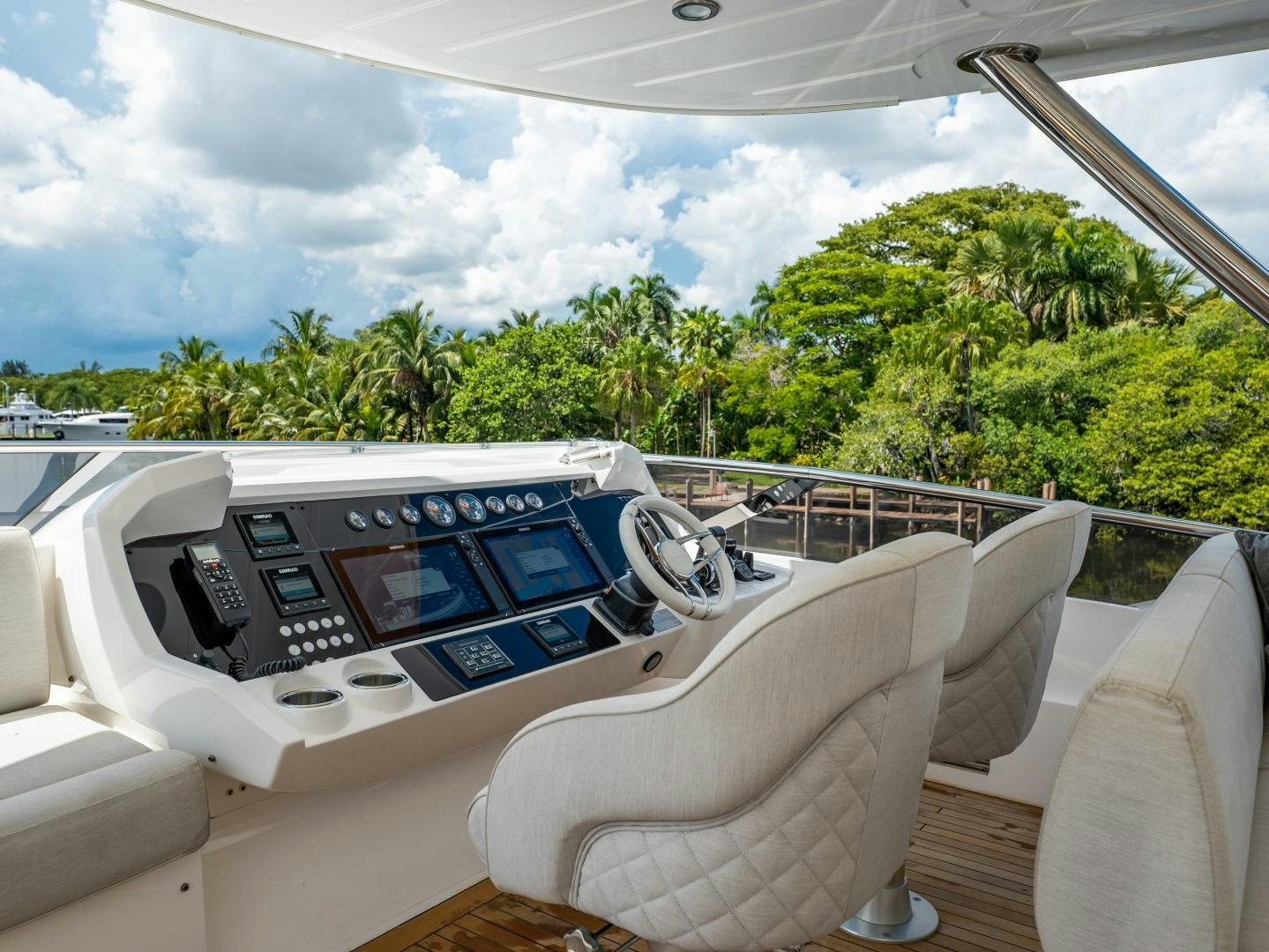 a white car with a screen on the dashboard aboard TATIS Yacht for Sale