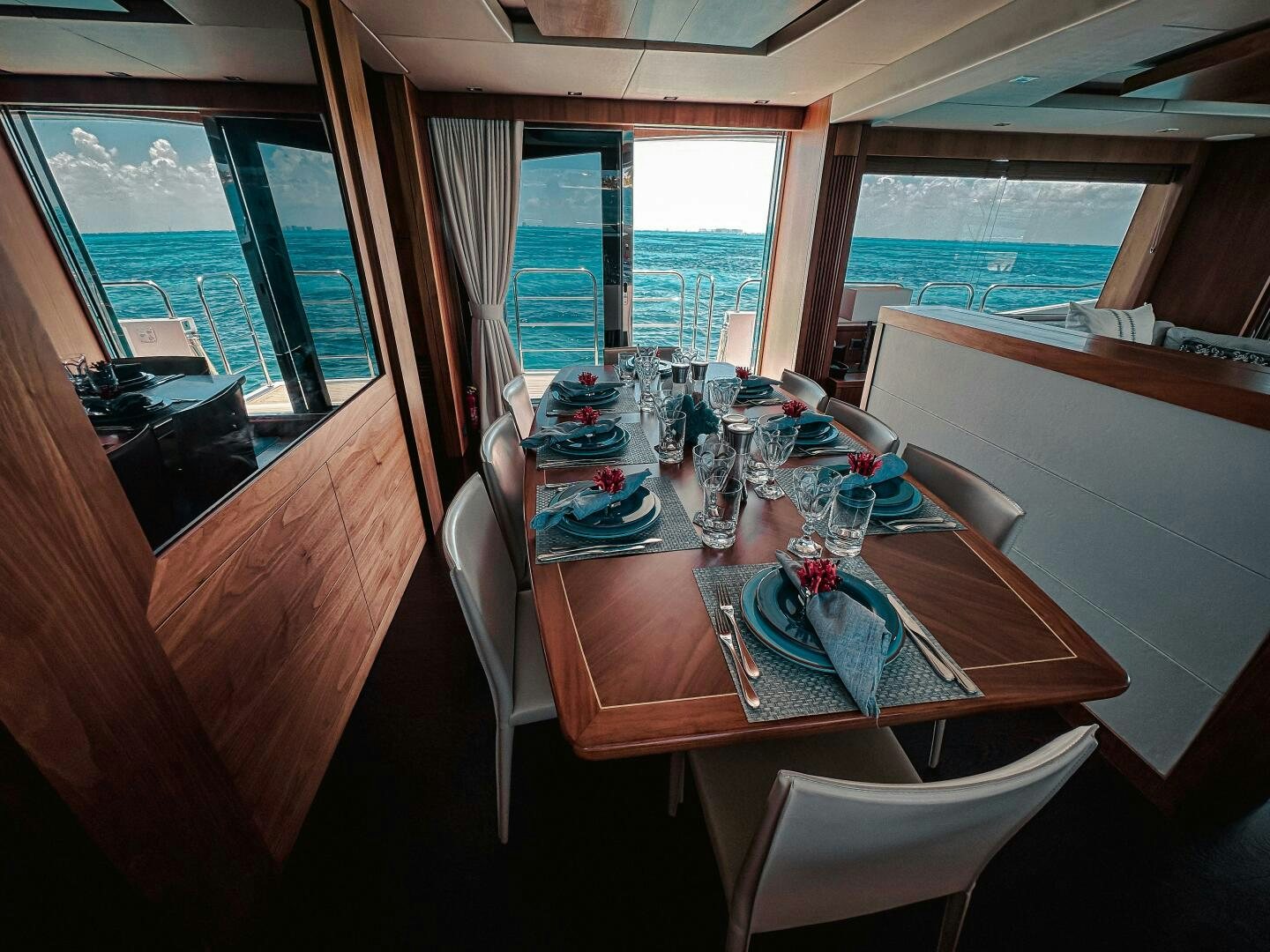 a dining table set for a meal aboard TATIS Yacht for Sale