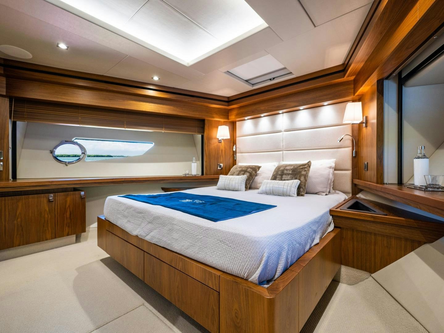 a room with a bed and a window aboard TATIS Yacht for Sale