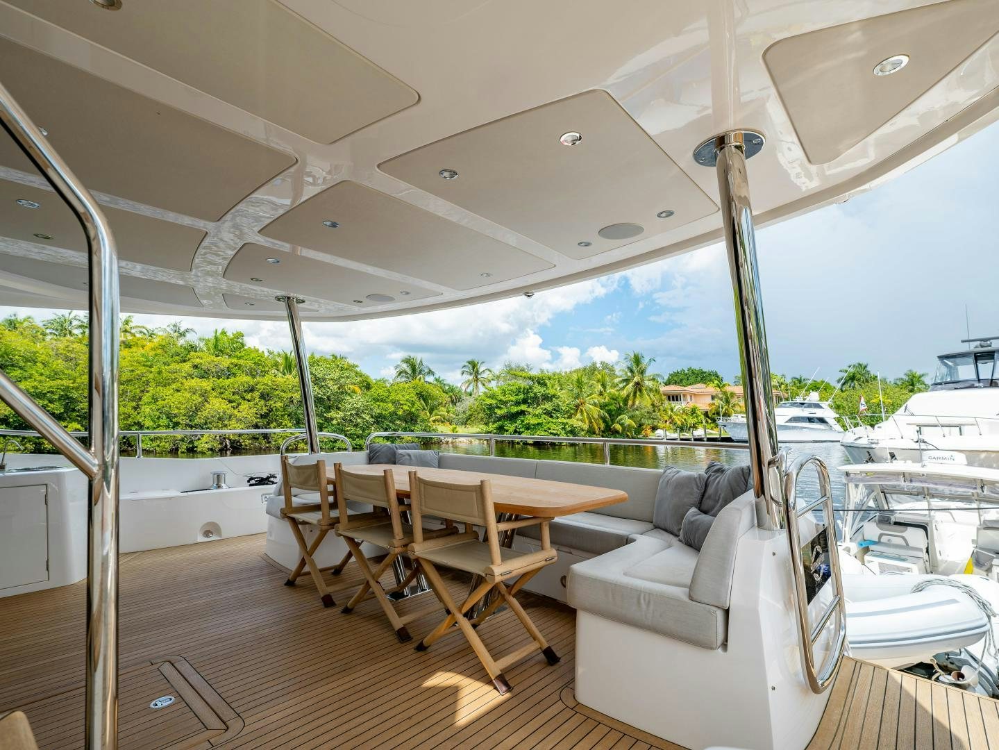 a large living room with a large deck and a large window aboard TATIS Yacht for Sale
