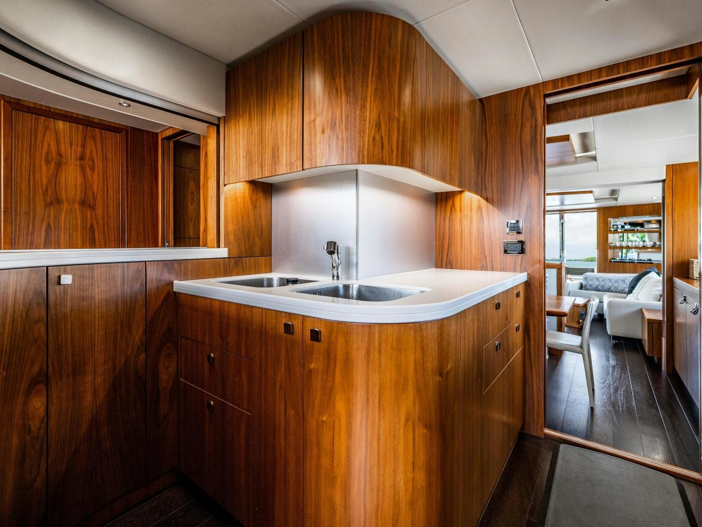 a kitchen with wooden cabinets aboard TATIS Yacht for Sale