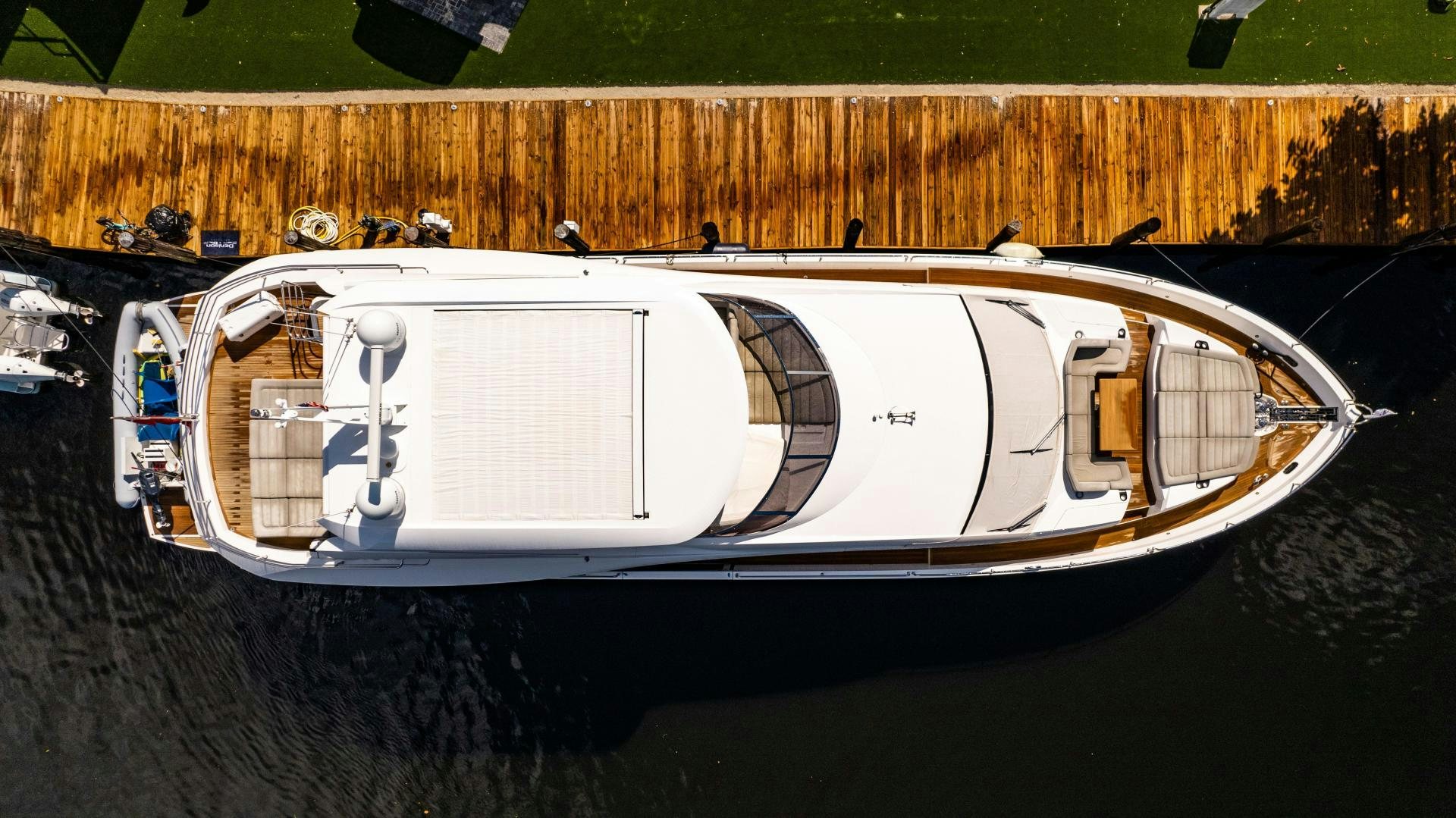 a white boat on a dirt surface aboard TATIS Yacht for Sale