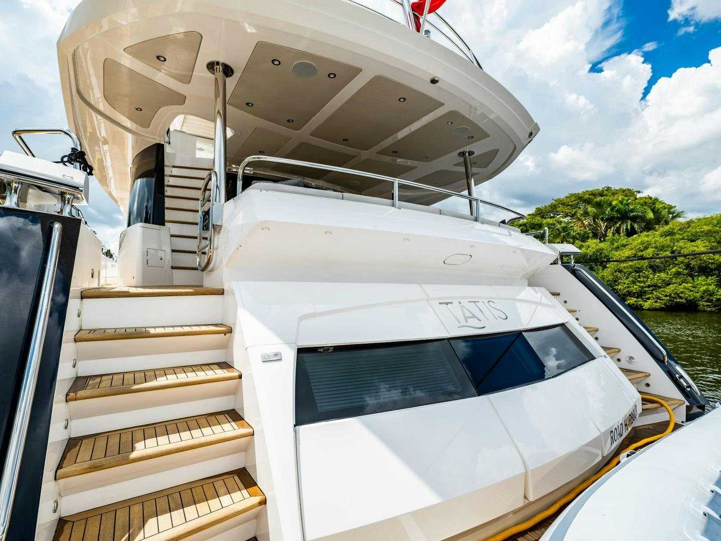 a boat with a staircase on the side aboard TATIS Yacht for Sale