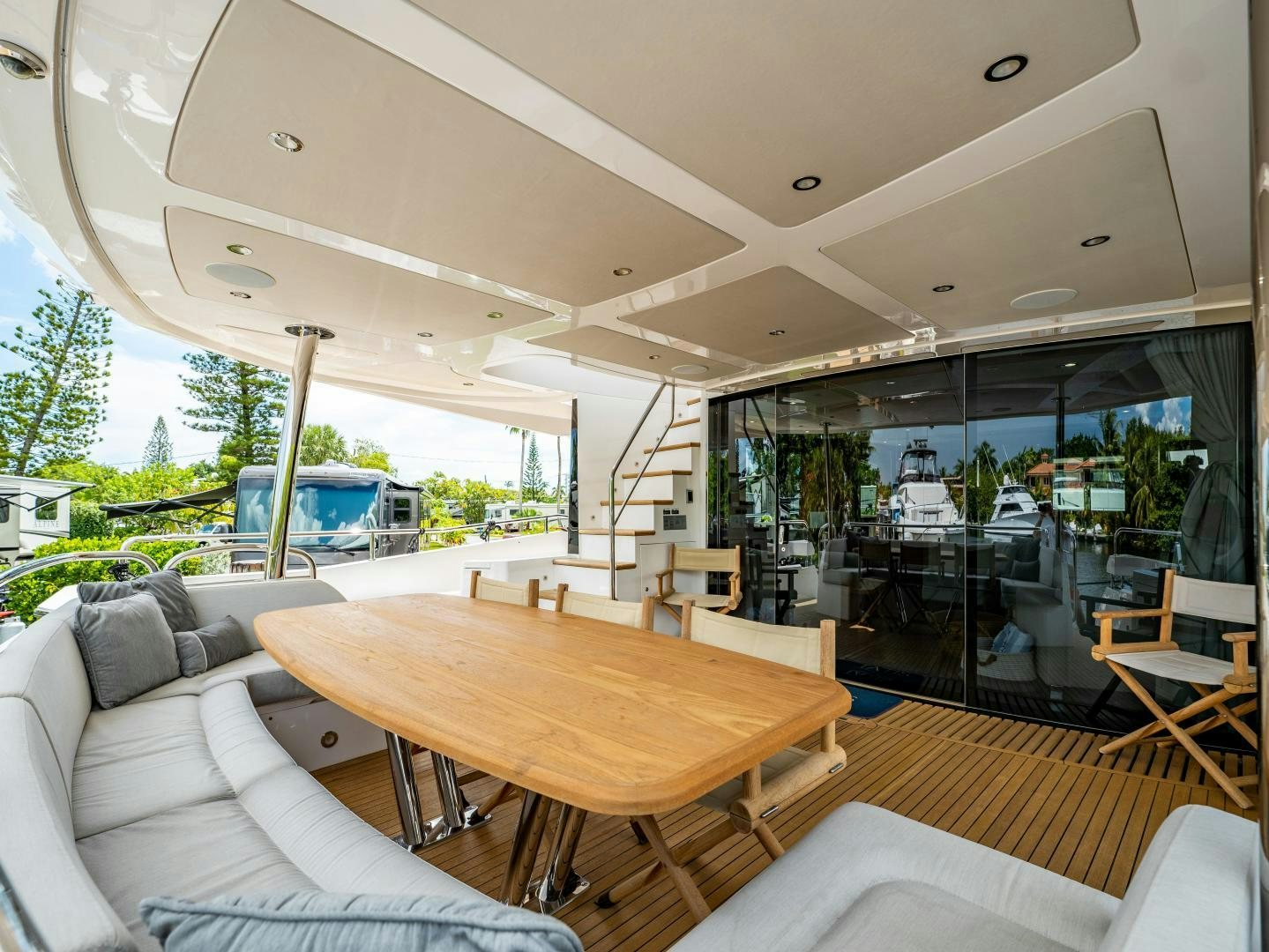 a living room with a table and couches aboard TATIS Yacht for Sale