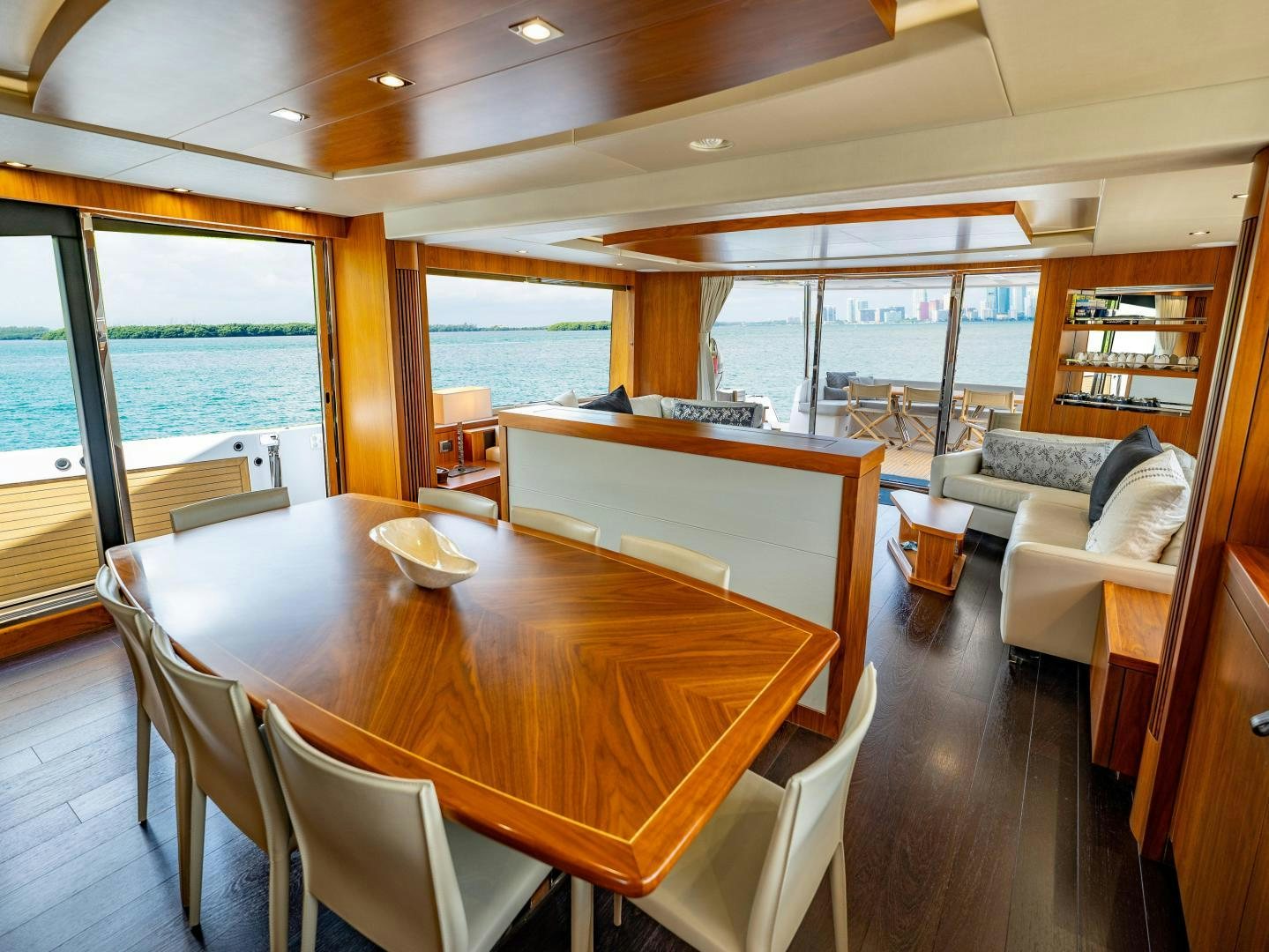 a large dining table in a room aboard TATIS Yacht for Sale