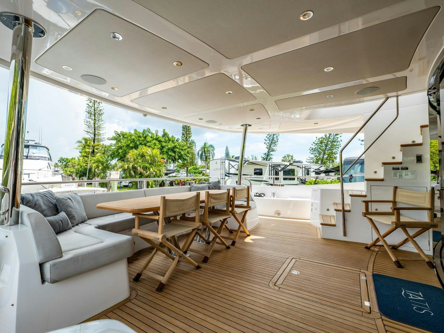 a living room with a wood floor aboard TATIS Yacht for Sale