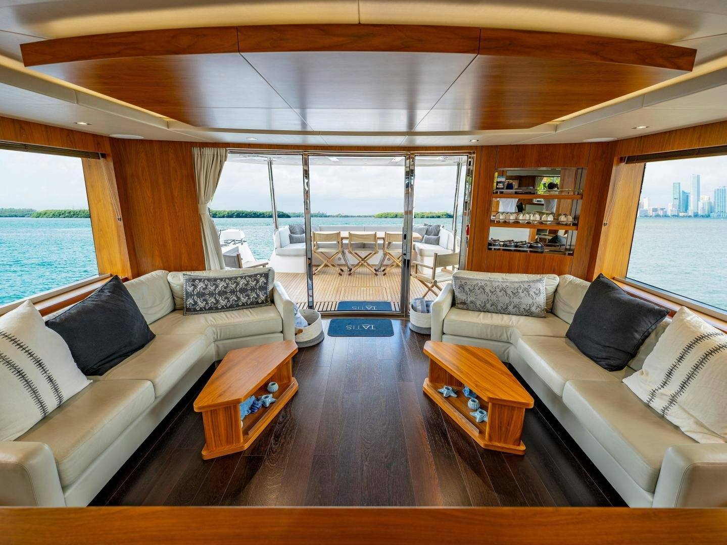 a living room with a large window aboard TATIS Yacht for Sale