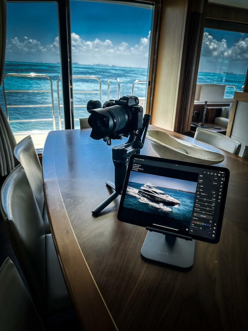 a camera on a table aboard TATIS Yacht for Sale