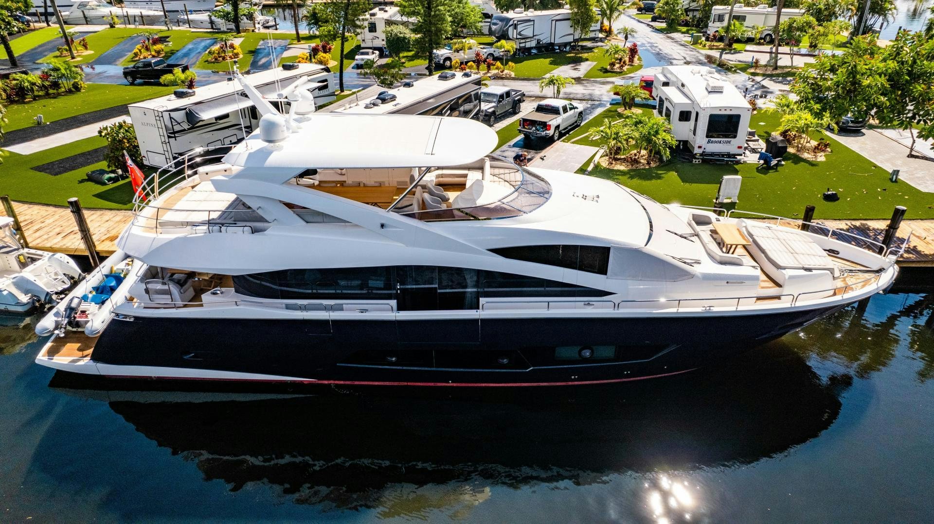 a boat docked at a pier aboard TATIS Yacht for Sale