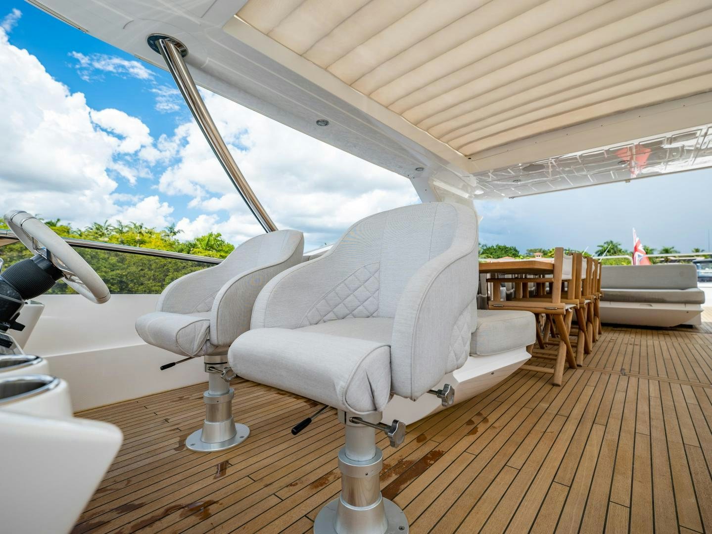 a white lounge chair on a deck aboard TATIS Yacht for Sale
