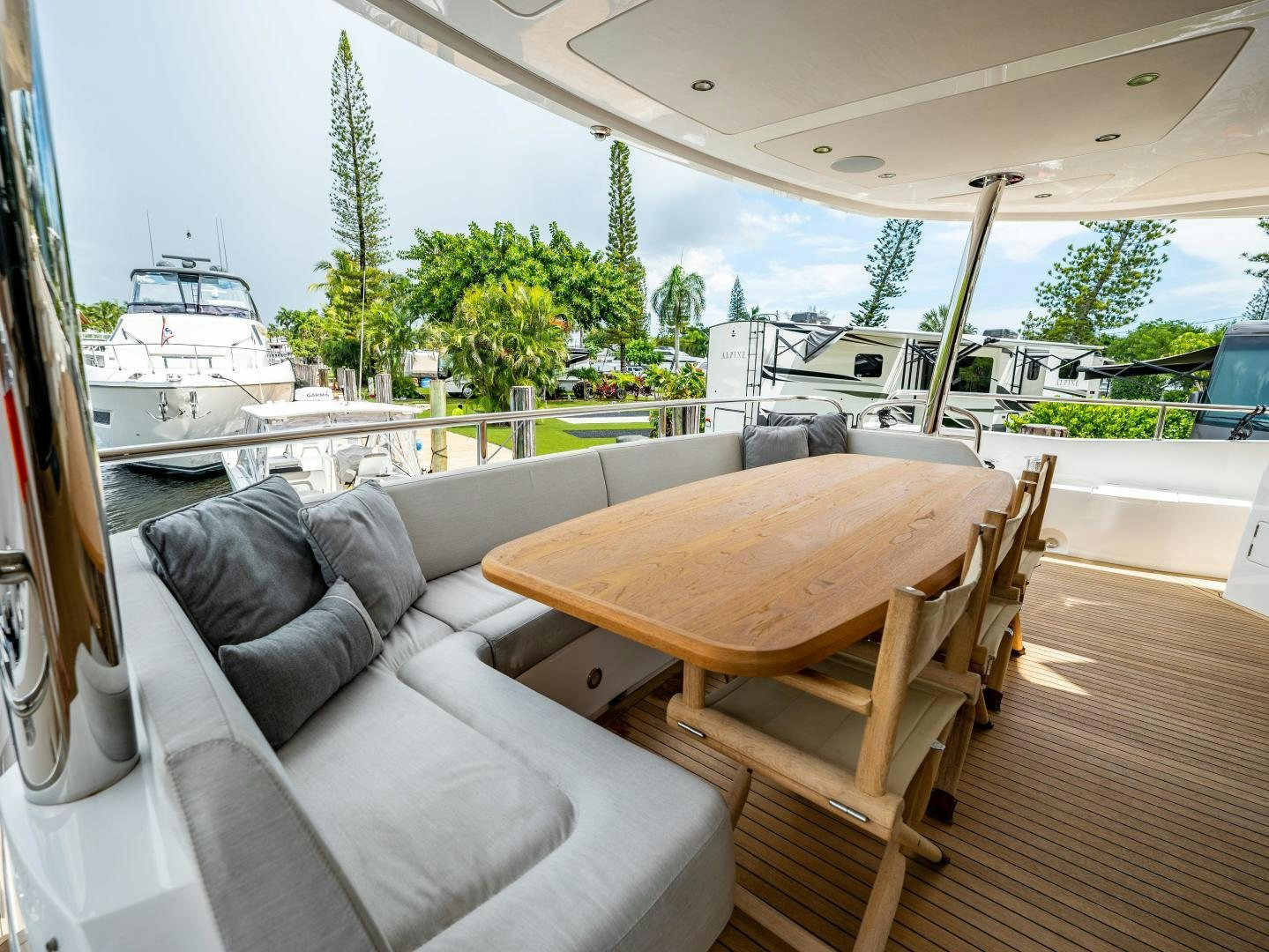 a couch and a table on a deck aboard TATIS Yacht for Sale