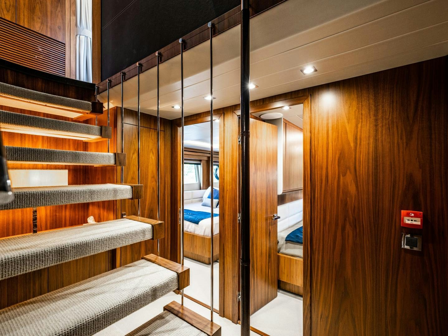 a wooden staircase with a glass door aboard TATIS Yacht for Sale