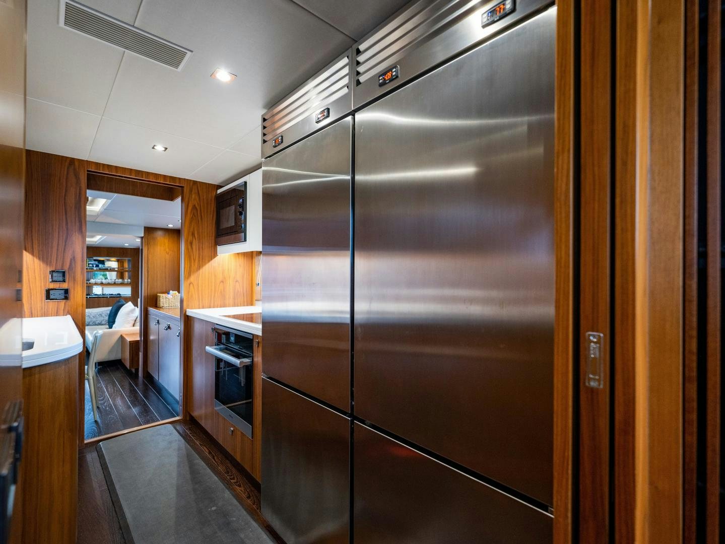 a large kitchen with stainless steel appliances aboard TATIS Yacht for Sale