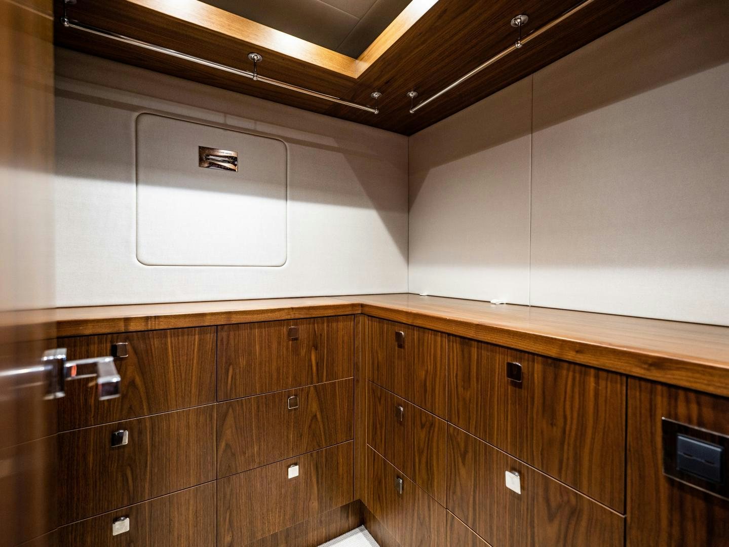 a room with wooden cabinets aboard TATIS Yacht for Sale