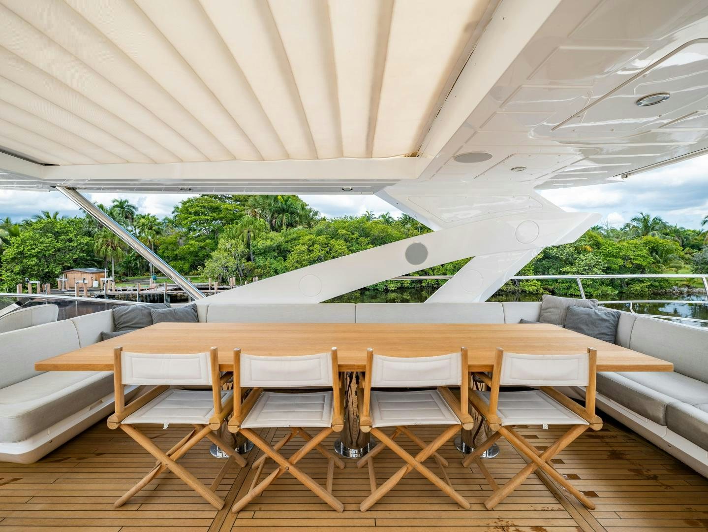 a table and chairs on a patio aboard TATIS Yacht for Sale
