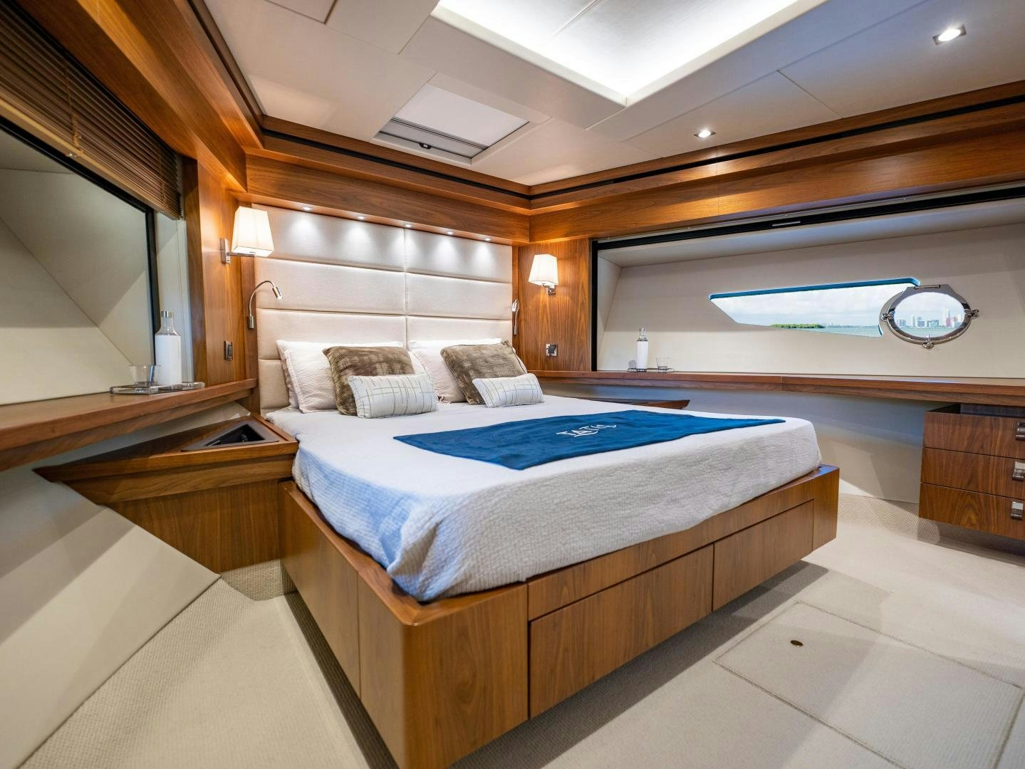 a room with a bed and a window aboard TATIS Yacht for Sale