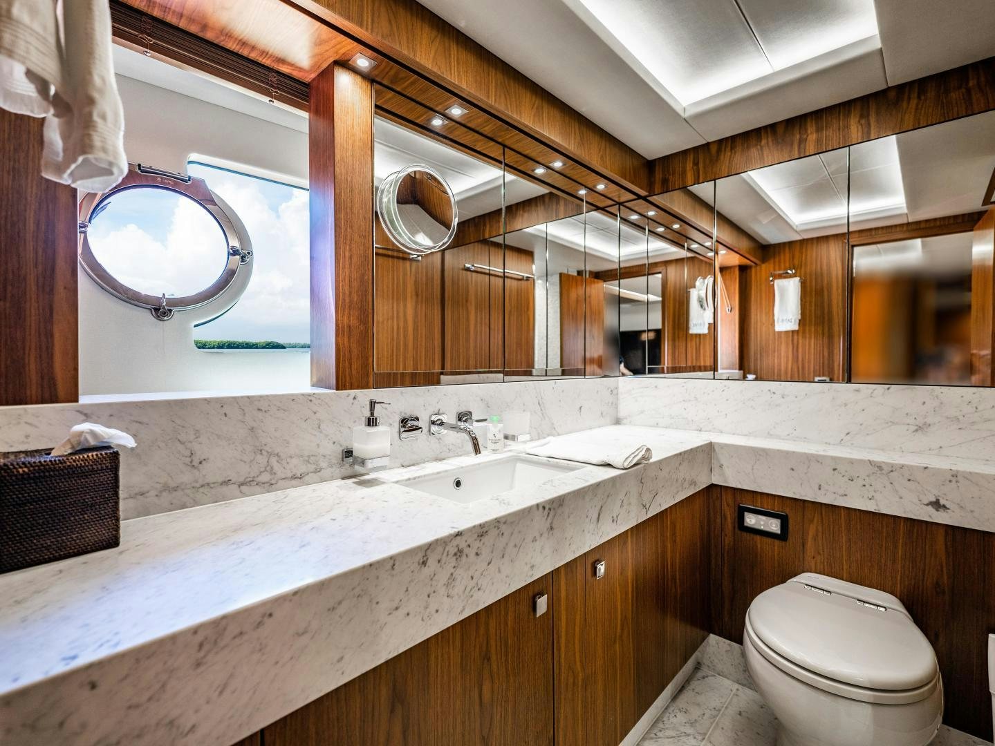 a bathroom with a large mirror aboard TATIS Yacht for Sale