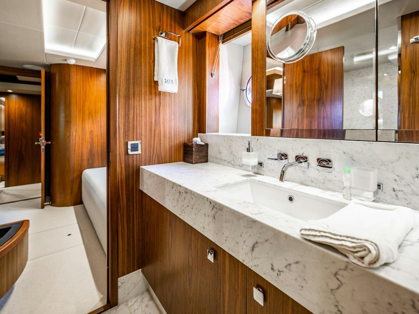 a bathroom with a sink and a mirror aboard TATIS Yacht for Sale