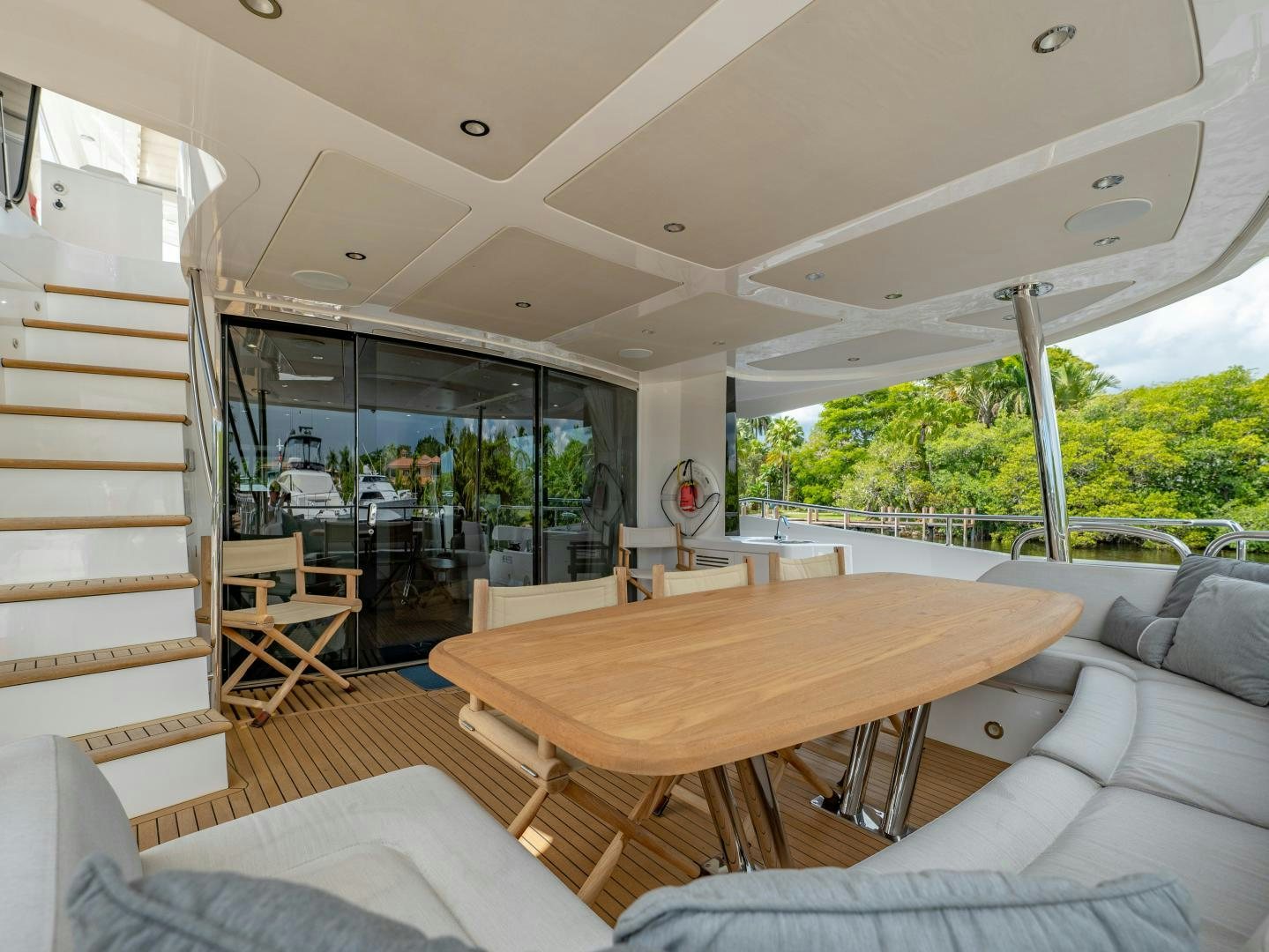 a room with a table and chairs aboard TATIS Yacht for Sale