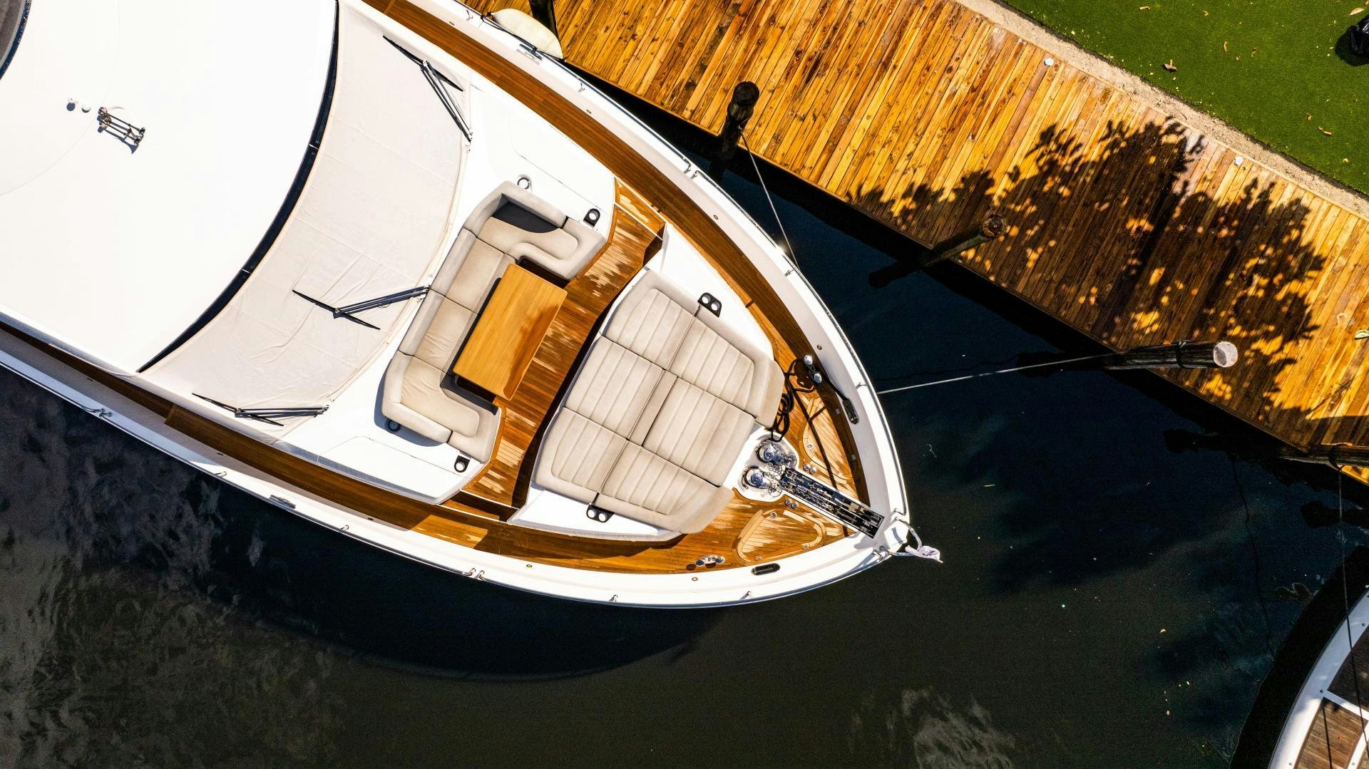 a white boat on a dock aboard TATIS Yacht for Sale