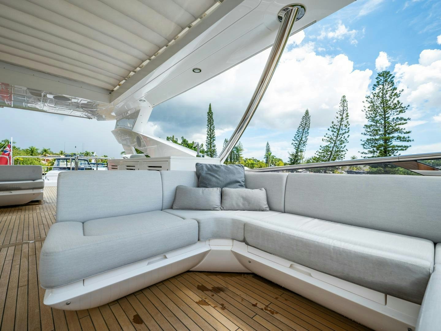 a white couch on a deck aboard TATIS Yacht for Sale