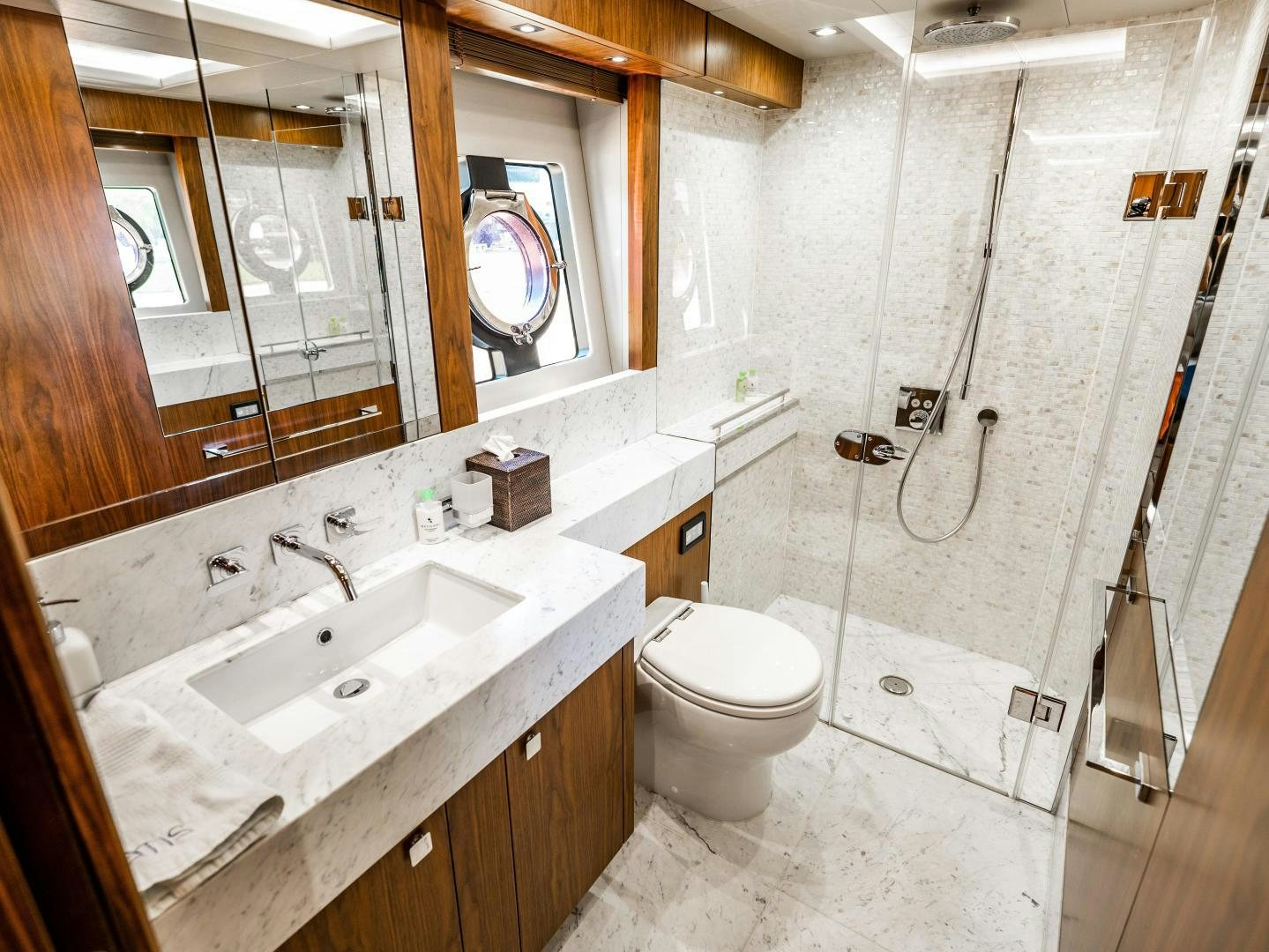 a bathroom with a sink toilet and a shower aboard TATIS Yacht for Sale