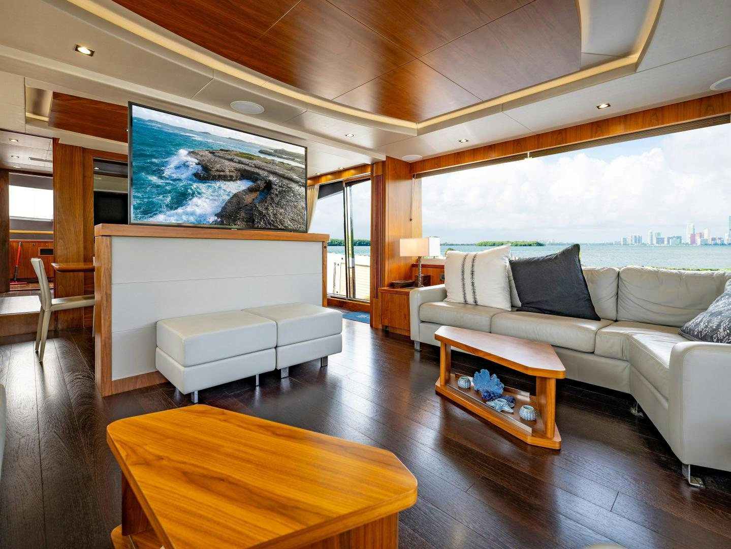 a living room with a large window aboard TATIS Yacht for Sale