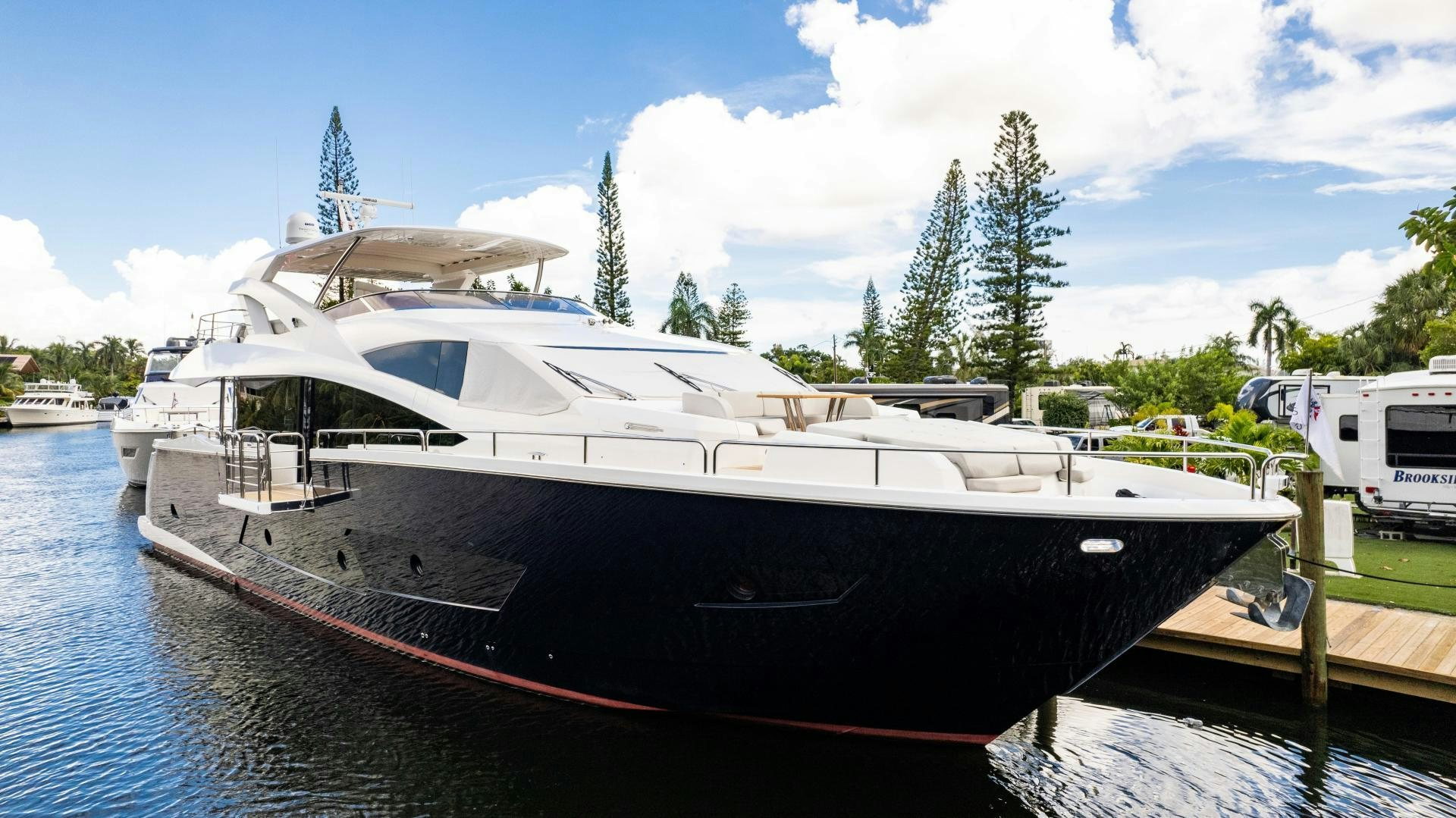 a boat docked at a pier aboard TATIS Yacht for Sale