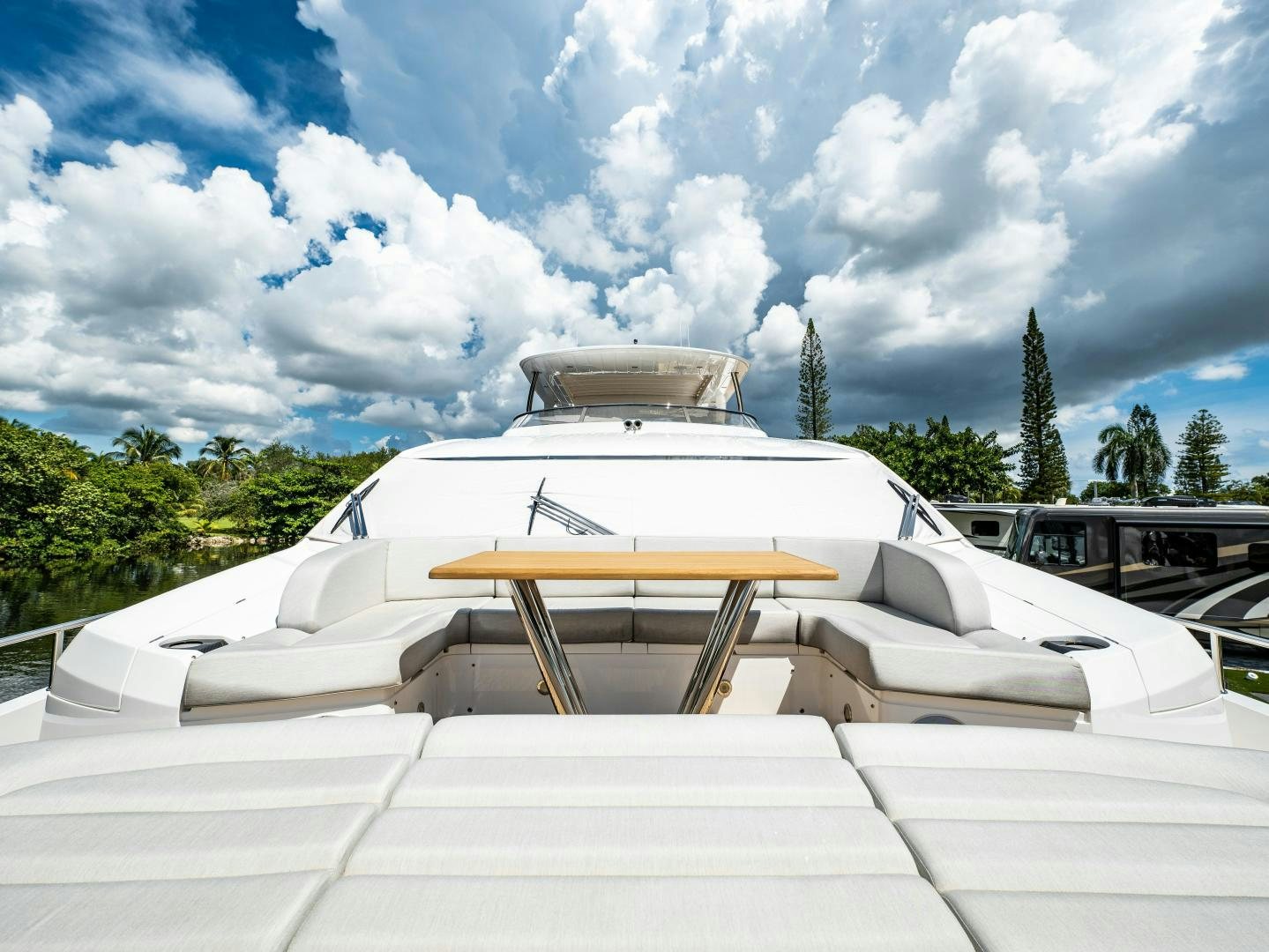 a white building with a dome roof and trees in the background aboard TATIS Yacht for Sale