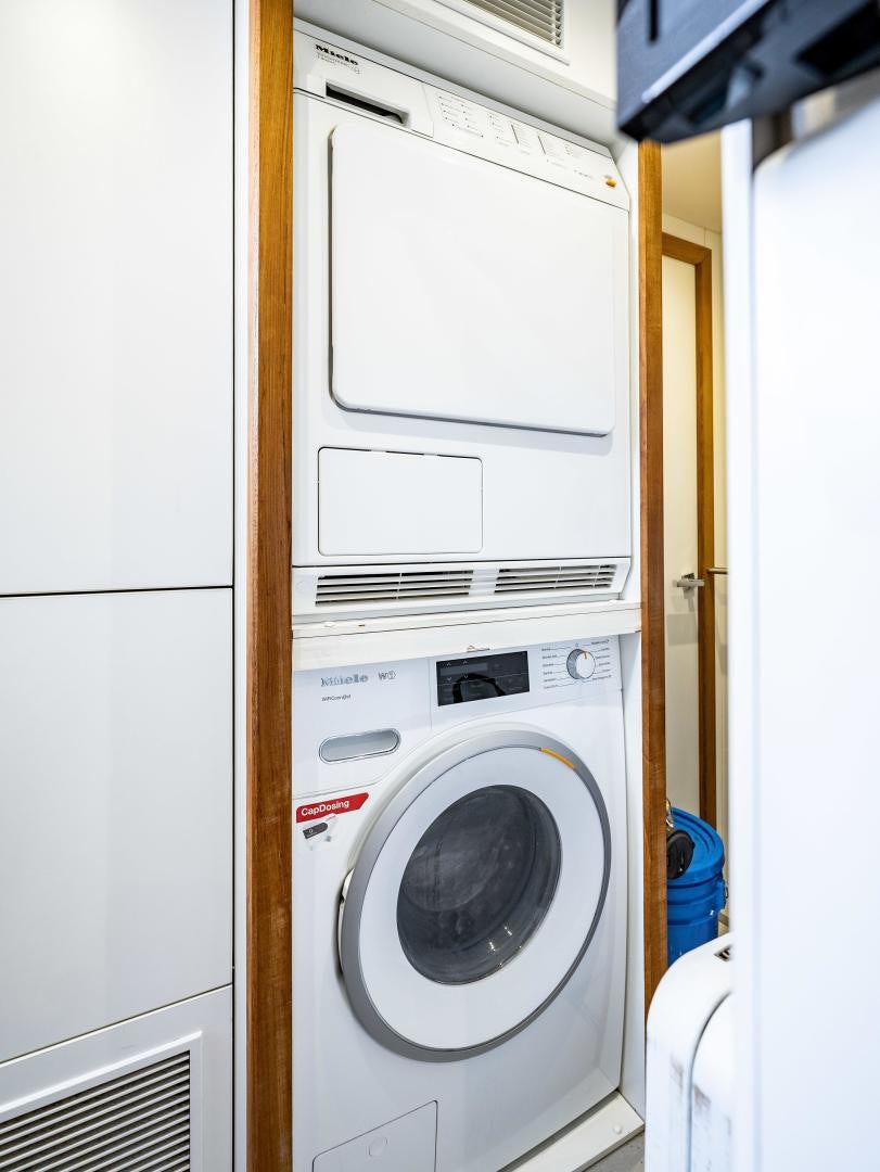 a washing machine in a room aboard TATIS Yacht for Sale