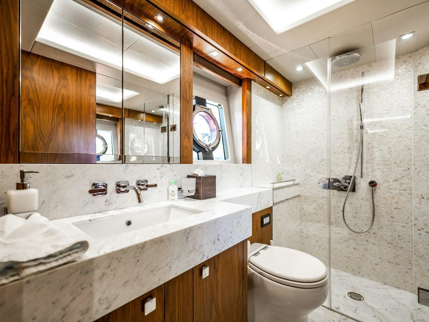 a bathroom with a sink toilet and a shower aboard TATIS Yacht for Sale