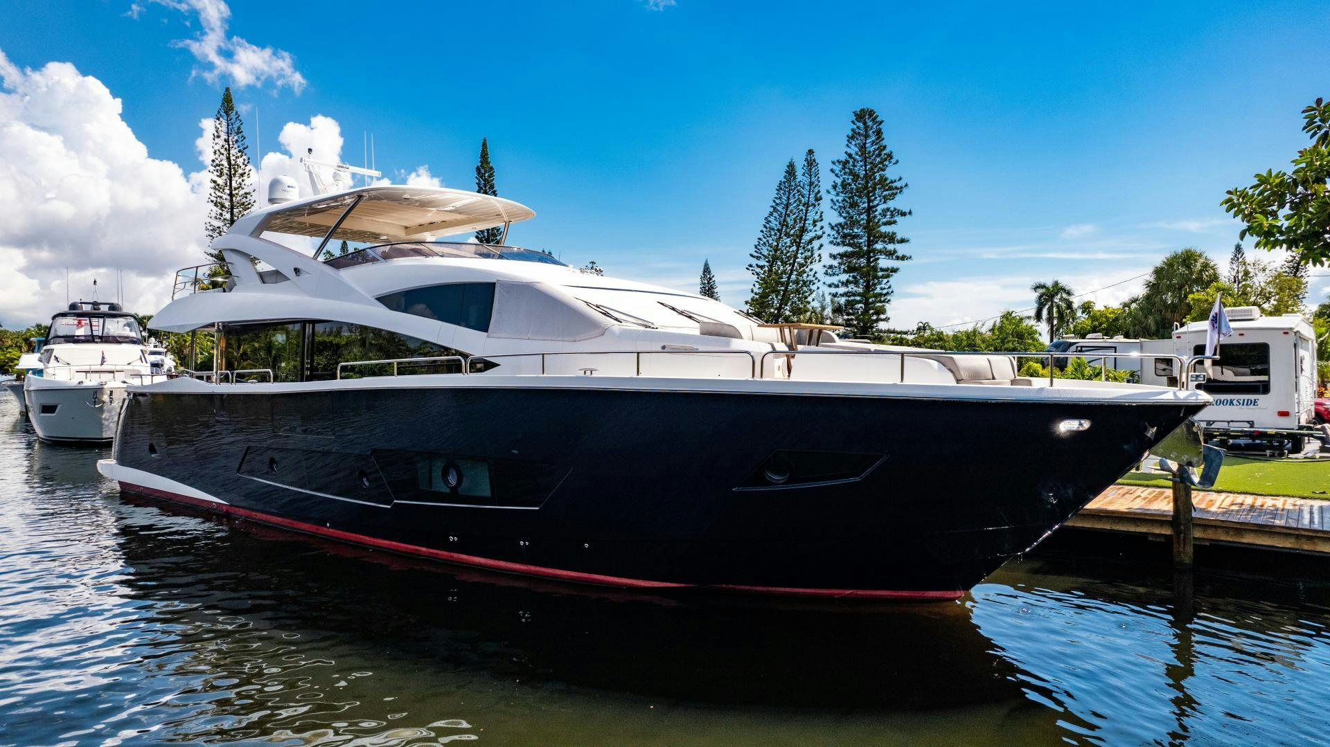 a boat docked at a pier aboard TATIS Yacht for Sale