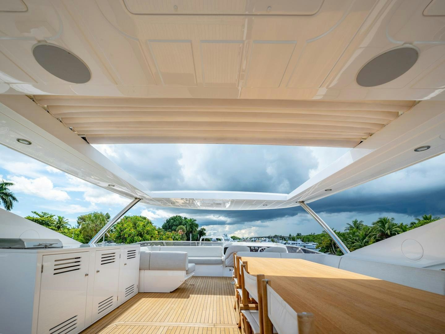 a white boat on a dock aboard TATIS Yacht for Sale