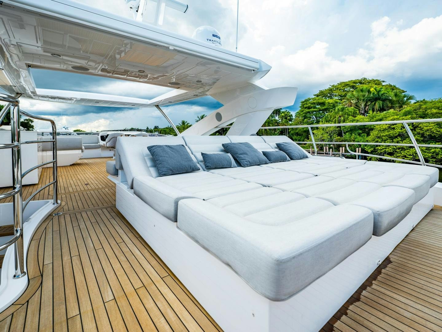 a large white lounge chair on a deck with a large white lounge chair and a large white lounge aboard TATIS Yacht for Sale